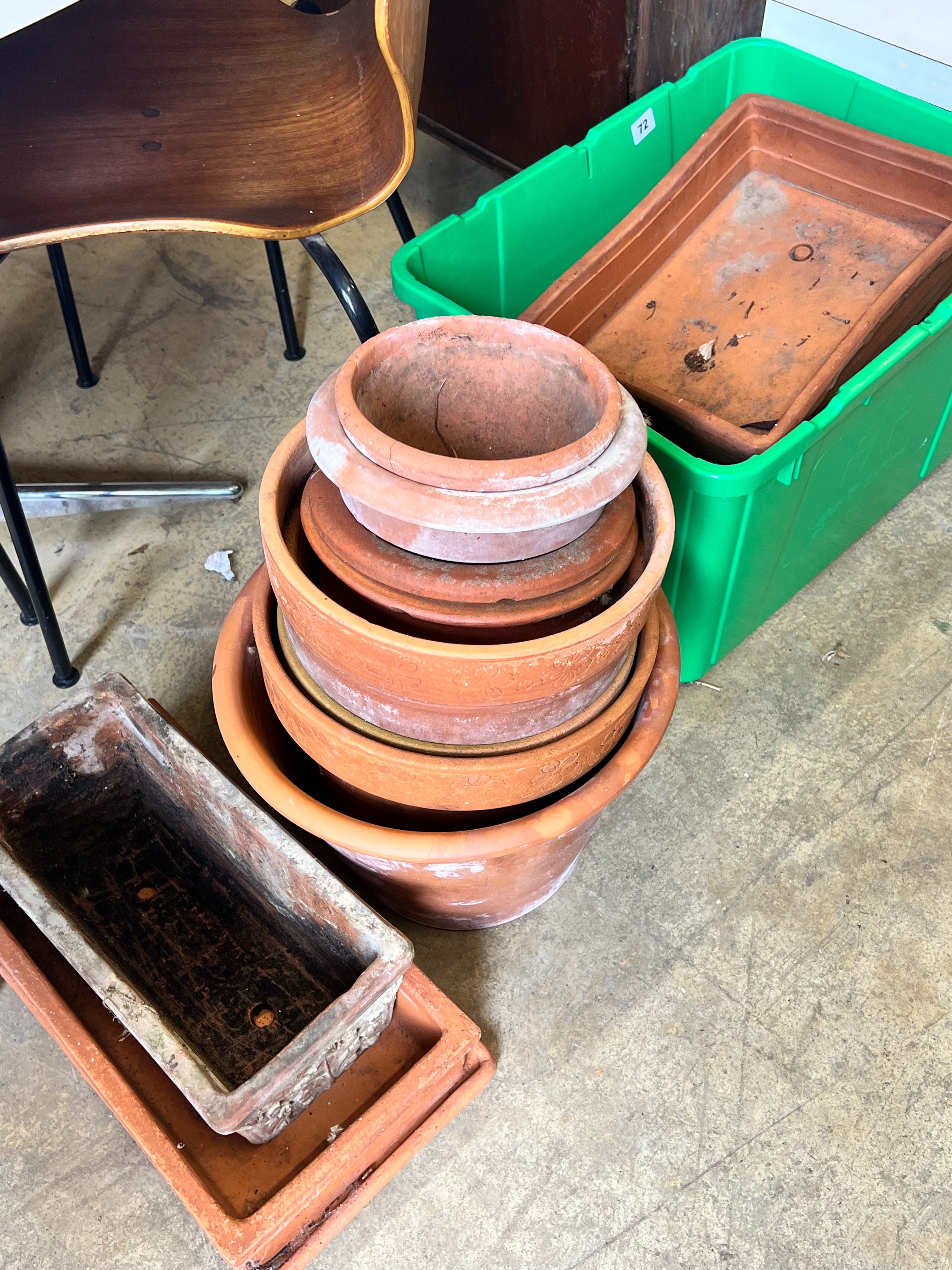 Approximately fifty assorted terracotta garden pots